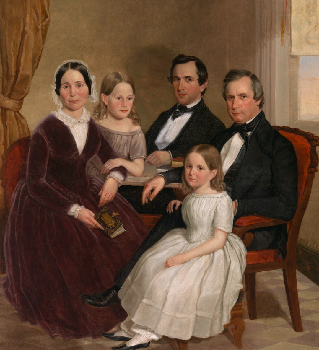 Sepia familieportret uit het begin van de twintigste eeuw
